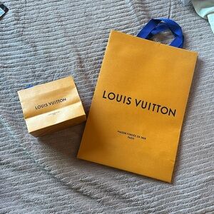 5 1/2” x 4 1/2” and 14” x 10” the 14 x 10 never used paper shopping bags